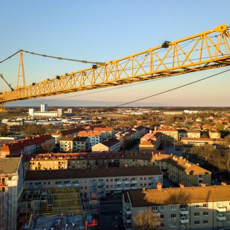 tower-crane-on-bright-blue-sky-copy-space-backgrou-2026-03-16-02-11-06-utc